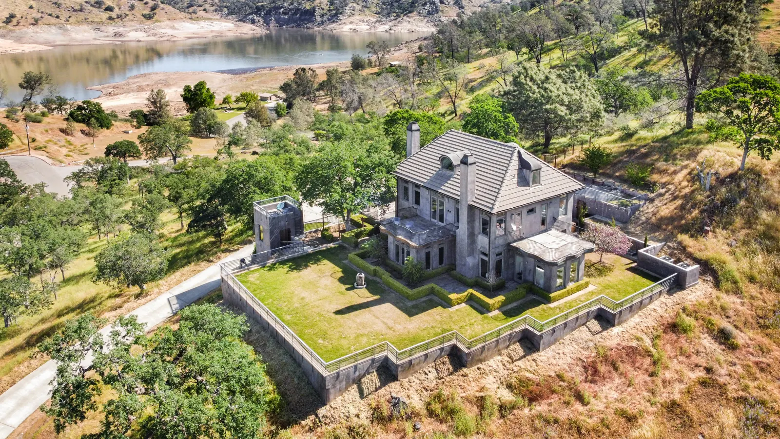 Aerial view of Millerton Lake Villa on its private hilltop with Millerton Lake behind
