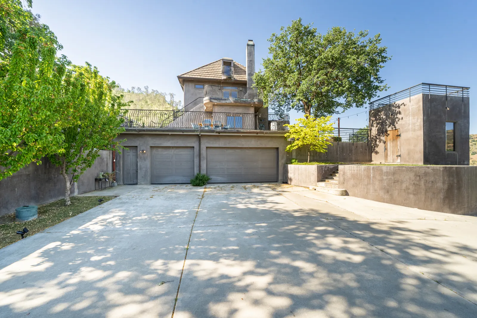 The house and its three-car garage from the driveway